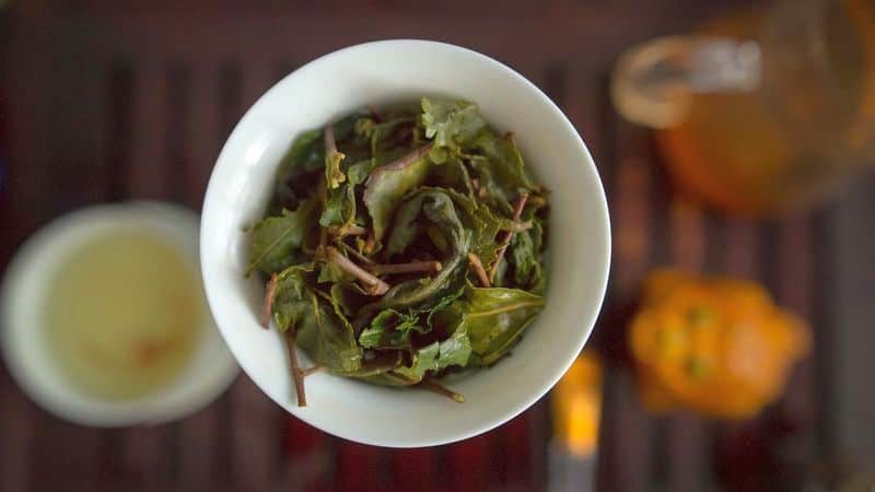 brewed green tea leaves in gaiwan