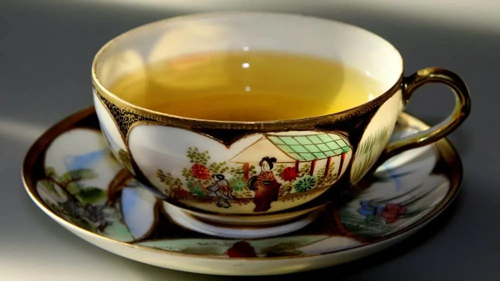 Beautiful cup with green tea