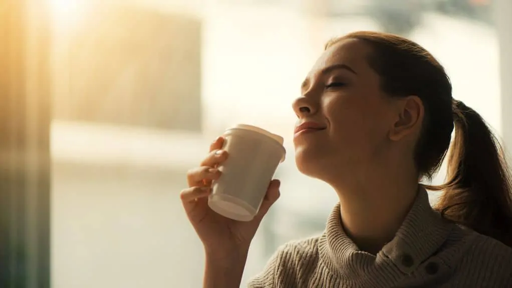 woman drinking cup of green tea