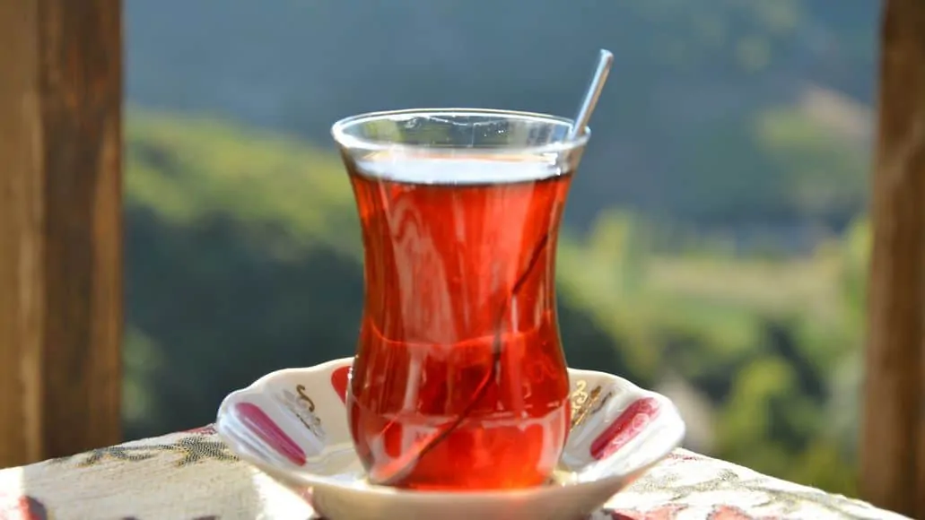 Hot cup of tea in the summer