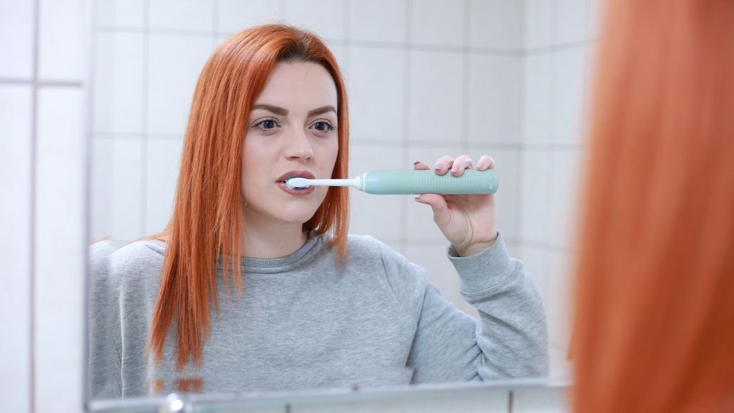 woman brushing teeth