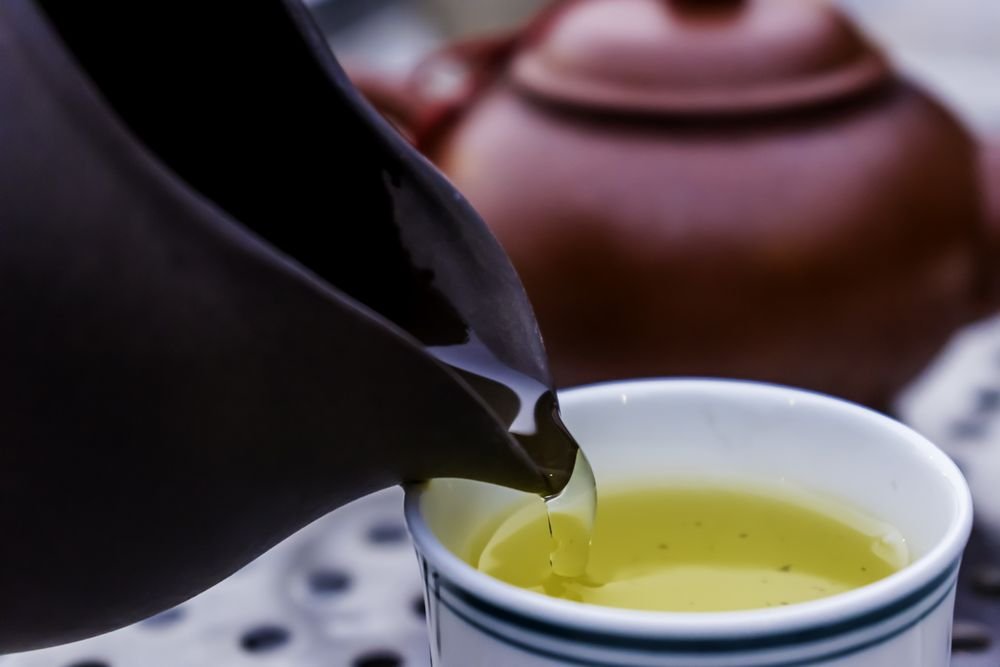 pouring a cup of green tea